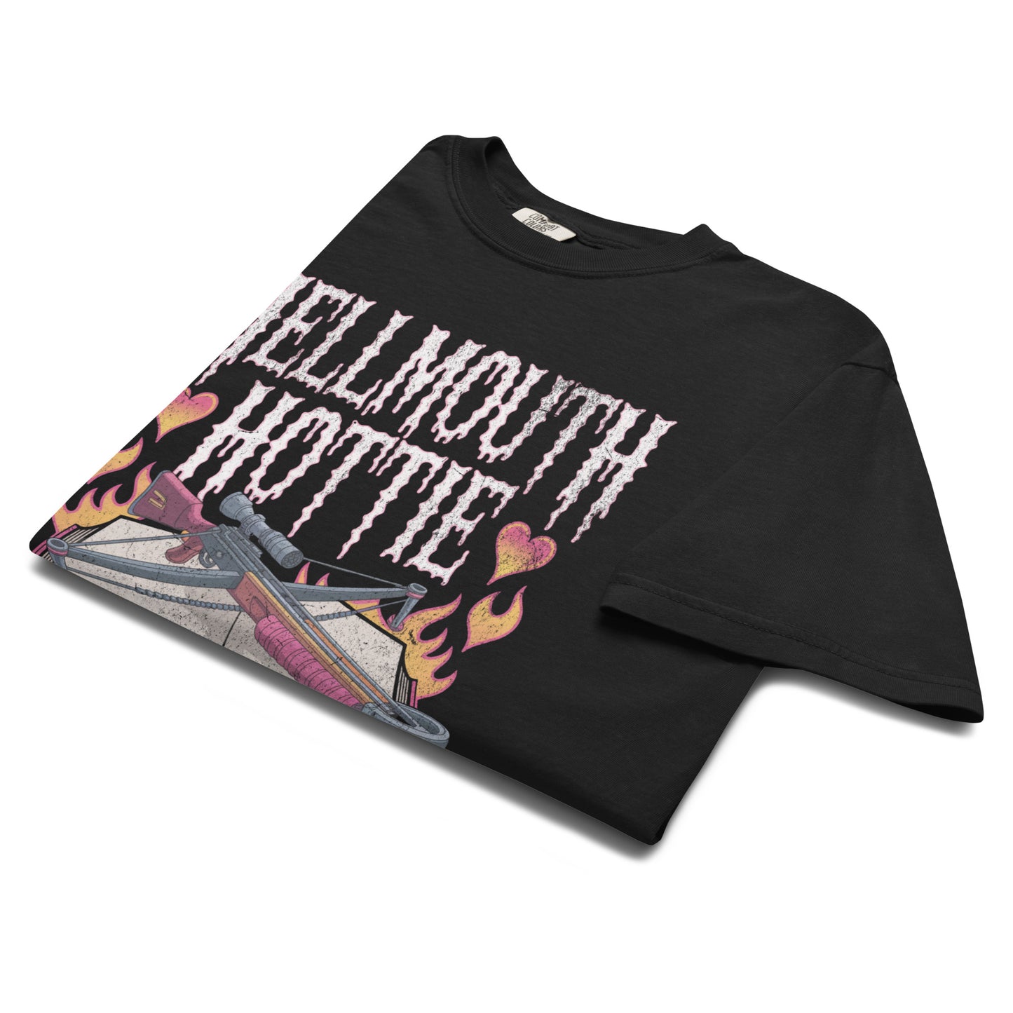 Folded black “Hellmouth Hottie” t-shirt flat lay showing spellbook and flame artwork, perfect for witchy, punk, or goth-inspired wardrobes.