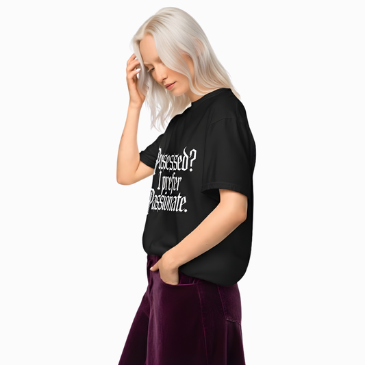 Model wearing black “Possessed? I Prefer Passionate.” t-shirt with elegant gothic lettering, styled with a moody velvet skirt for a dark feminine aesthetic.