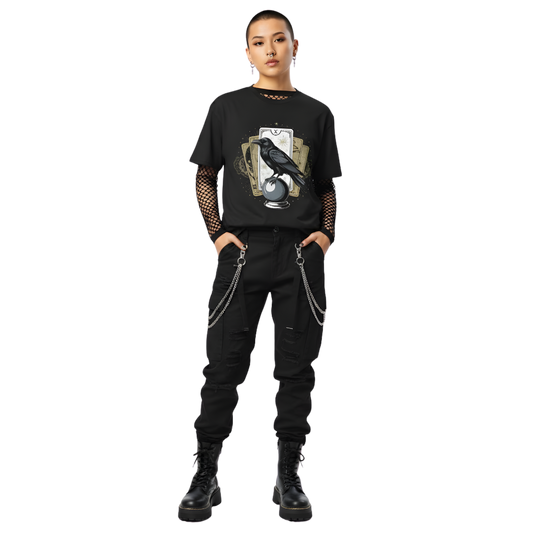 Model wearing black raven and tarot card t-shirt with crystal ball artwork, styled for a dark academia or witchy gothic aesthetic.