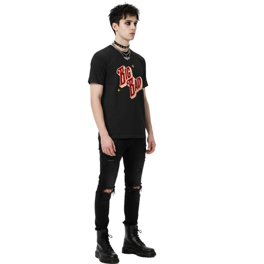 Model wearing a black t-shirt with bold red and cream retro text reading ‘Big Bad,’ styled with black jeans and dark aesthetic.