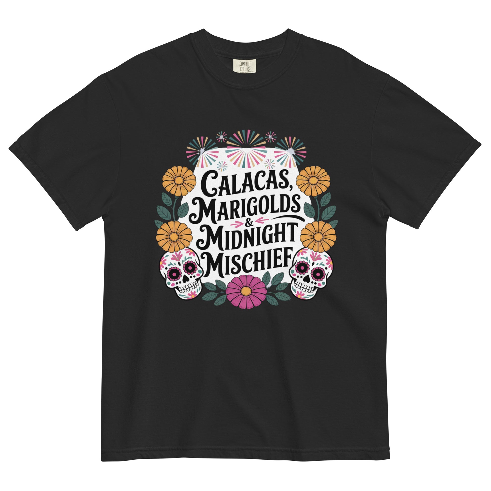 Black t-shirt with colorful Día de los Muertos design featuring sugar skulls, marigolds, and the phrase ‘Calacas, Marigolds & Midnight Mischief’ displayed flat on white background.