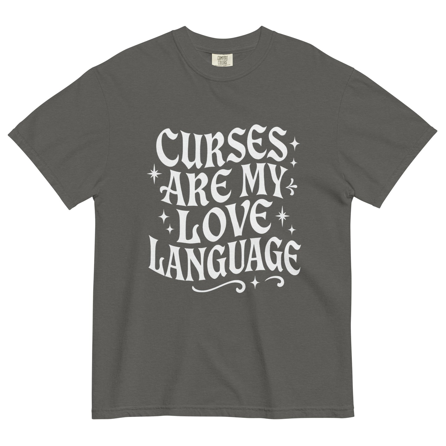 Pepper gray t-shirt laid flat featuring white gothic-style text reading ‘Curses Are My Love Language,’ surrounded by small stars.