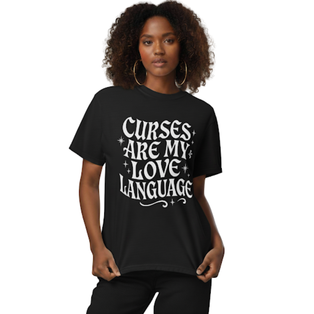 Model wearing a black t-shirt printed with the phrase ‘Curses Are My Love Language’ in whimsical gothic lettering