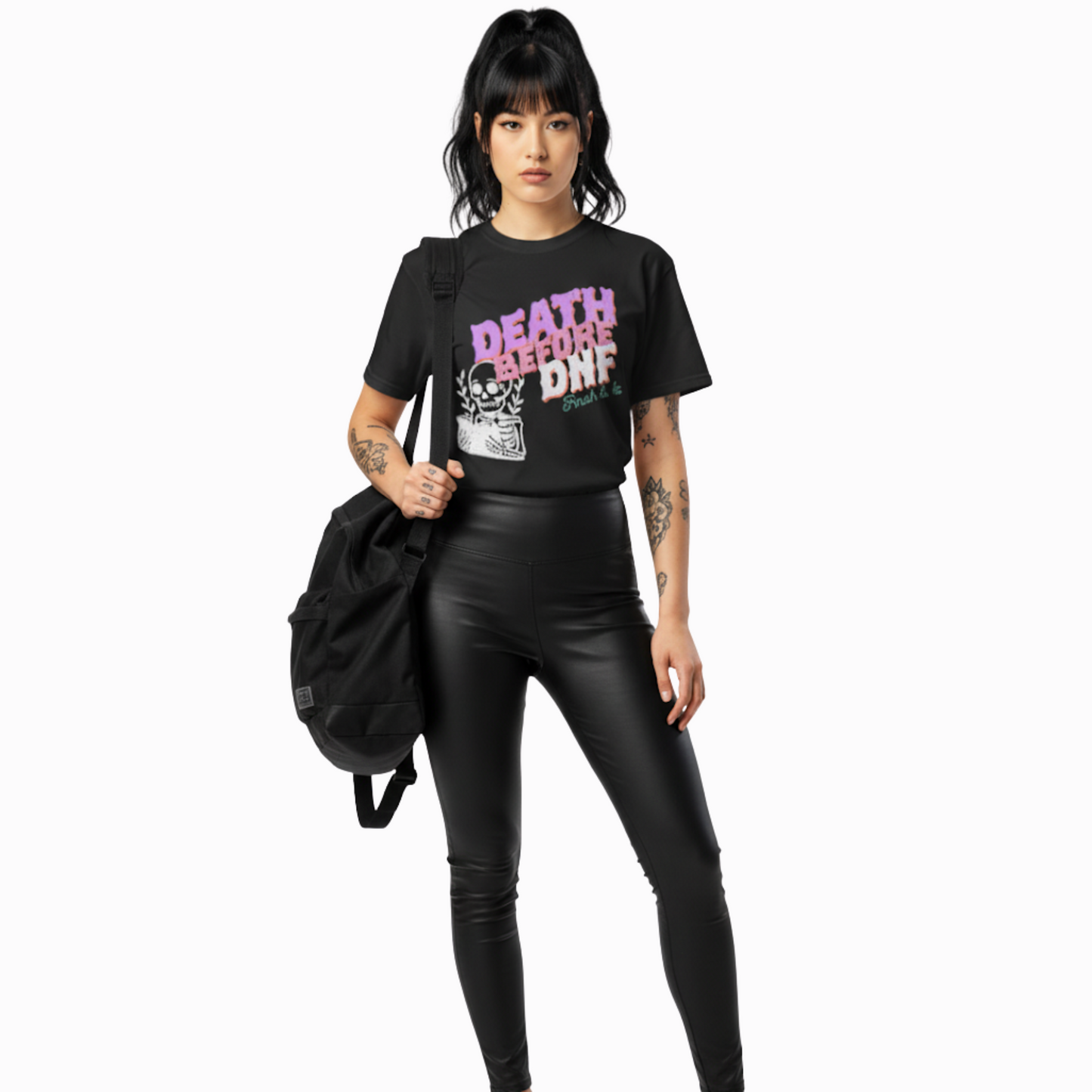 Model wearing black “Death Before DNF” t-shirt with bold distressed lettering and skeleton artwork, styled for an alternative, punk, or witchy aesthetic.