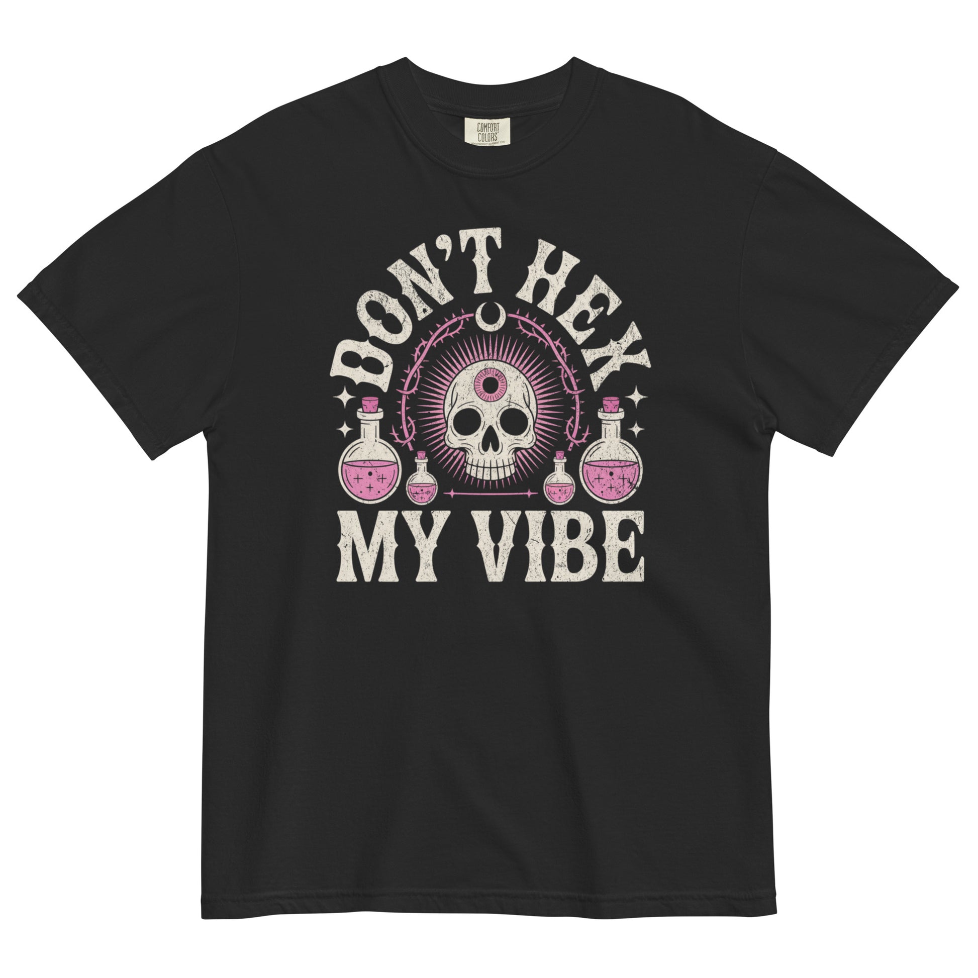 Don’t Hex My Vibe T-shirt flat lay showing witchy skull and potion design on black Comfort Colors tee