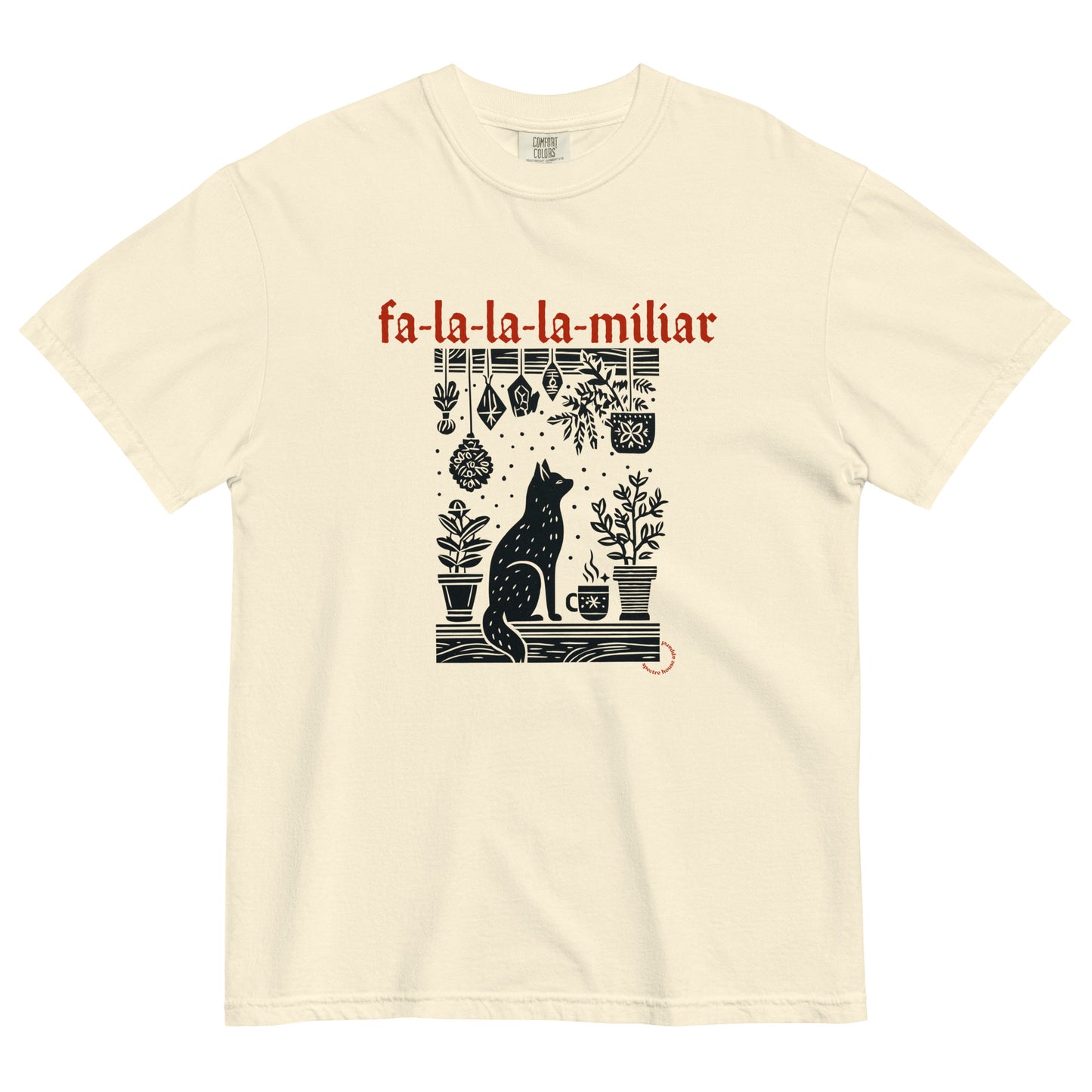 Fa-La-La-La-Miliar Familiar Cat Holiday Tee shown flat on a neutral background, featuring a black cat, herbs, and red gothic lettering.