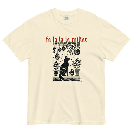 Fa-La-La-La-Miliar Familiar Cat Holiday Tee shown flat on a neutral background, featuring a black cat, herbs, and red gothic lettering.