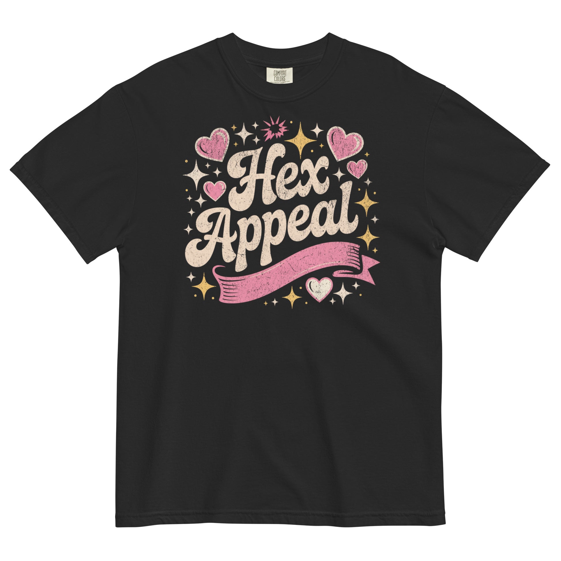 Black t-shirt lay flat featuring sparkly pink and gold “Hex Appeal” text with hearts and stars, a cute witchy graphic tee with retro charm and magical energy.