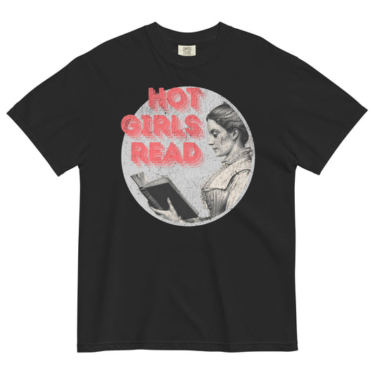 Black t-shirt lay flat with distressed red “Hot Girls Read” text over a vintage-style illustration of a woman reading, a witty retro book lover graphic tee.