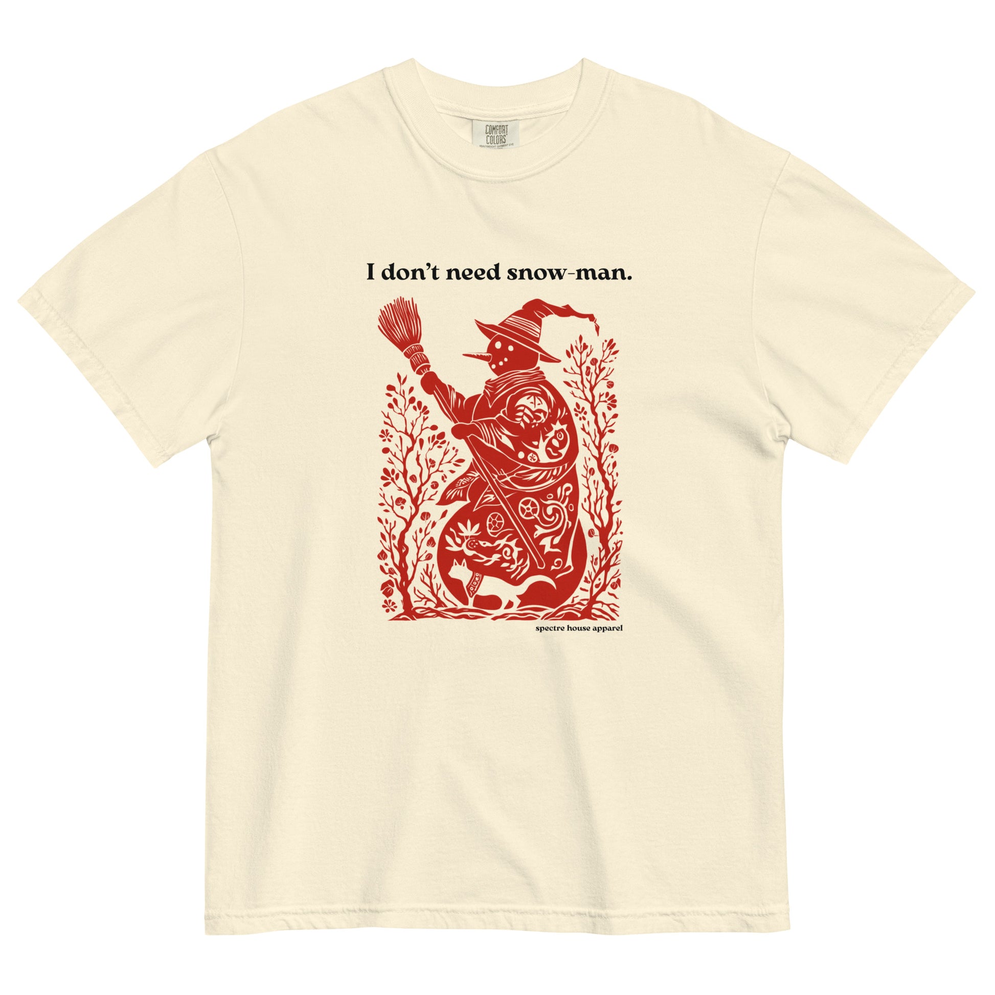 Ivory Comfort Colors T-shirt with red witch illustration and “I don’t need snow man” text, shown lay flat on white background.