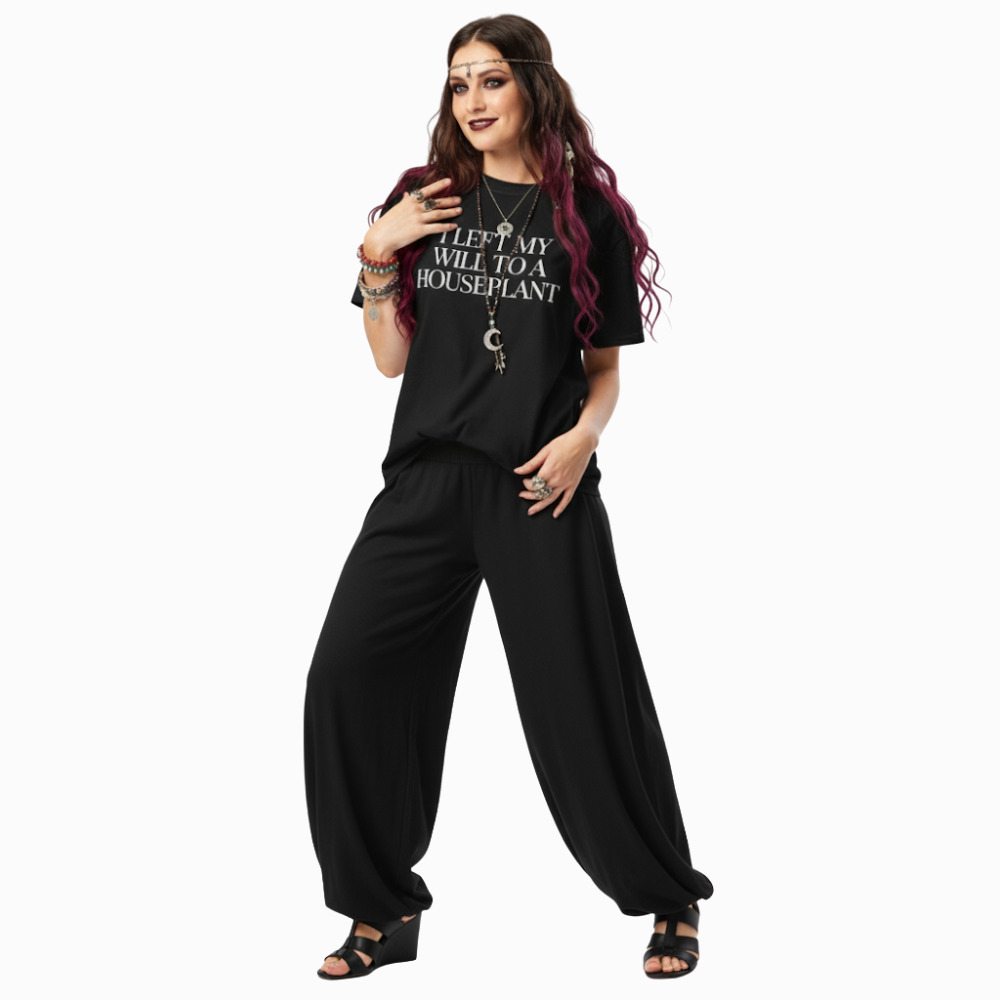 Model wearing black “I Left My Will to a Houseplant” t-shirt with simple white text, styled for a casual gothic or alt streetwear look.