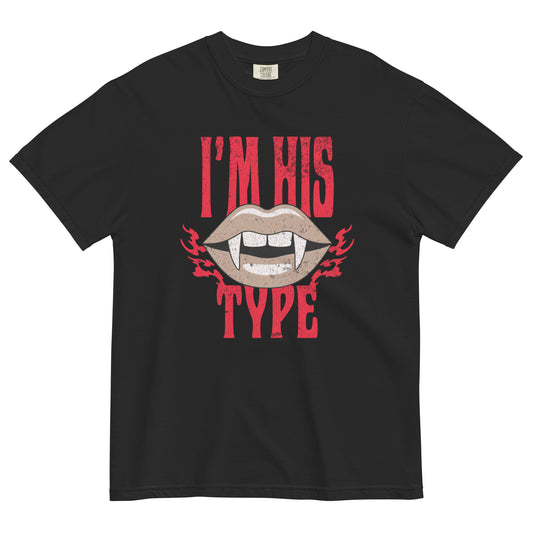 Black t-shirt lay flat featuring bold red text reading “I’m His Type” with vampire fangs and dripping blood, a playful gothic tee for horror and Halloween lovers.