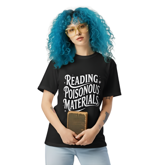Model wearing black “Reading Poisonous Materials” t-shirt with whimsical white script and star accents, styled for an alternative bookish aesthetic.