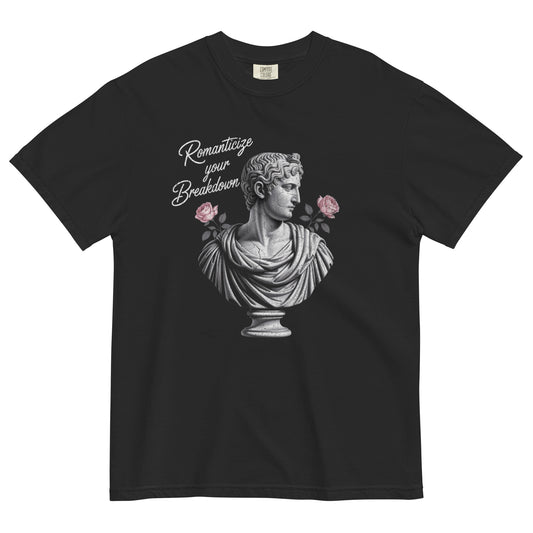 Black t-shirt lay flat featuring a neoclassical marble bust holding pink roses with text reading “Romanticize Your Breakdown,” a darkly elegant vintage-inspired tee.