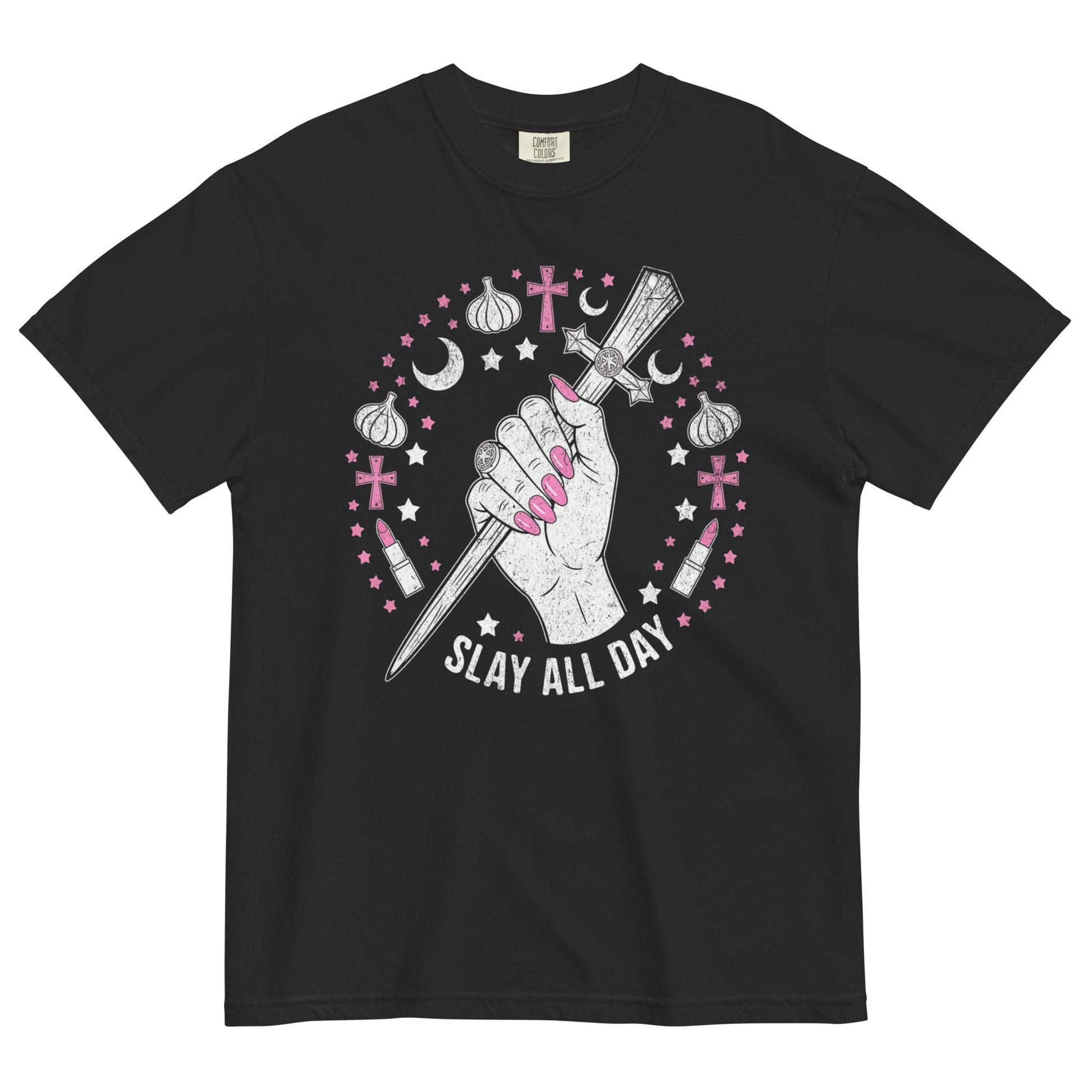 Black t-shirt lay flat featuring a hand gripping a wooden stake surrounded by pink stars, moons, and garlic bulbs with text “Slay All Day,” a Buffy the Vampire Slayer–inspired gothic tee.
