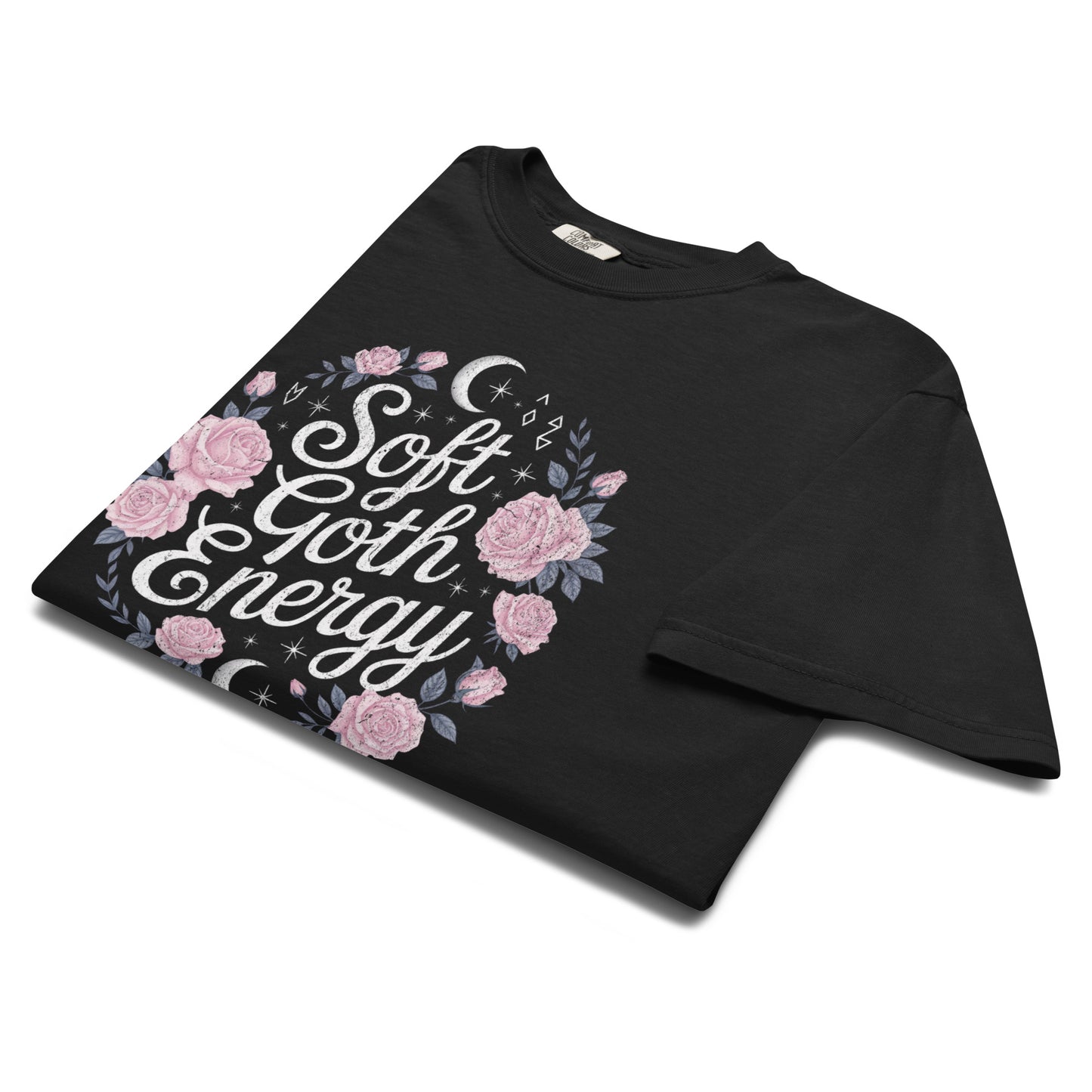 Folded black “Soft Goth Energy” t-shirt flat lay showing floral and moon design, perfect for lovers of dark feminine fashion and soft alt style.