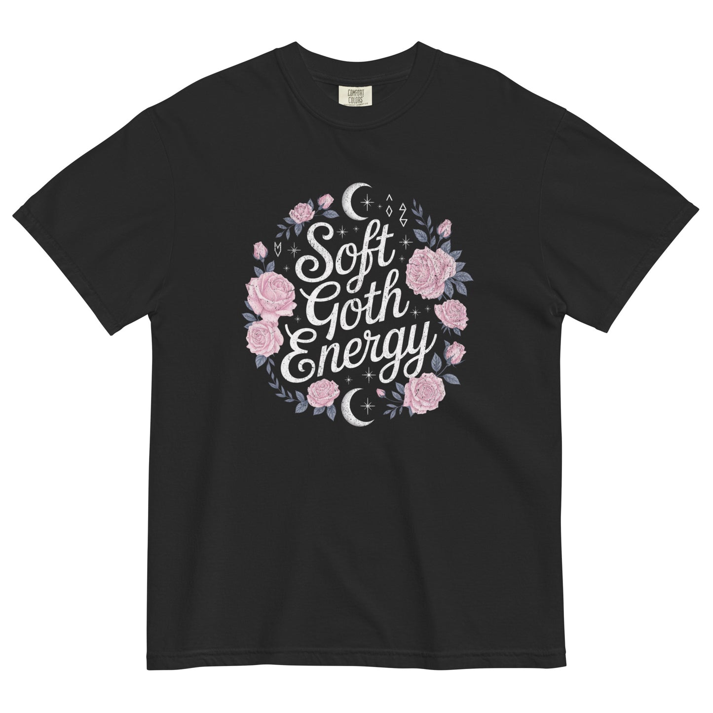 Black t-shirt lay flat featuring “Soft Goth Energy” text surrounded by pink roses, moons, and stars — a romantic gothic graphic tee with celestial floral design.