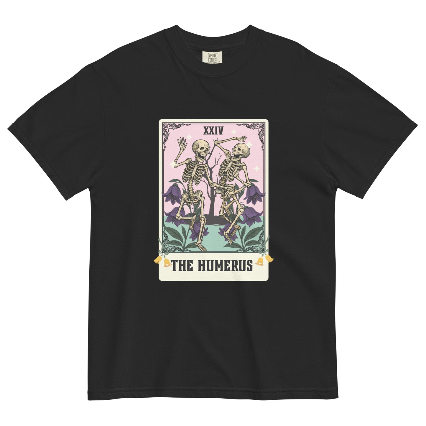 Black t-shirt lay flat featuring “The Humerus” tarot card-style design with two skeletons and floral details, a witty occult-inspired graphic tee with pastel tones.