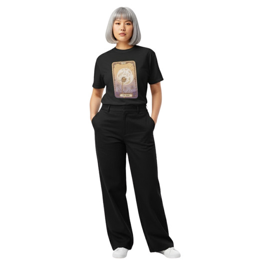 Model wearing black “The Sun” tarot card t-shirt with soft golden hues and floral detailing, styled for a witchy, bohemian-inspired aesthetic.