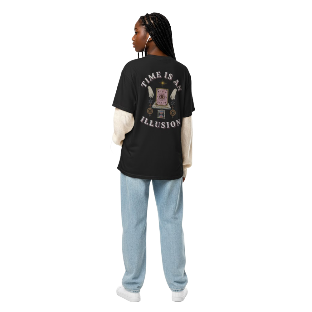 Model wearing “Time Is an Illusion” graphic t-shirt showing back print with clock eye design, styled with jeans for a relaxed vintage look.