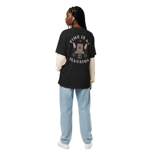 Model wearing “Time Is an Illusion” graphic t-shirt showing back print with clock eye design, styled with jeans for a relaxed vintage look.