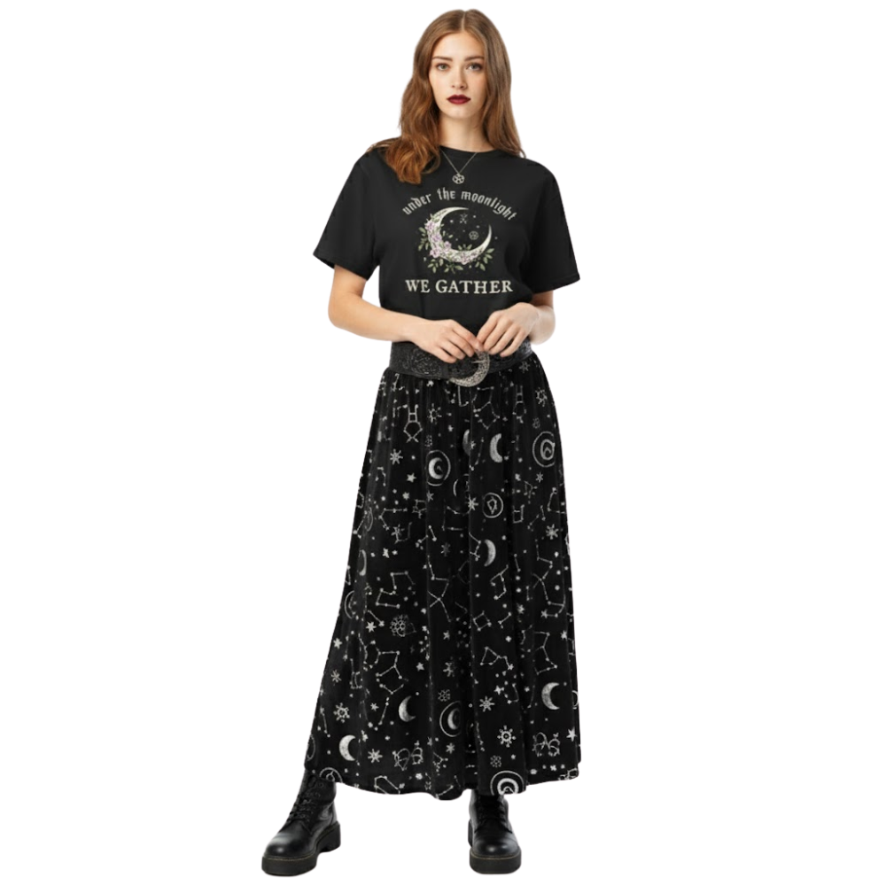 Model wearing black “Under the Moonlight We Gather” graphic tee paired with a celestial skirt, showcasing a witchy moon aesthetic outfit.