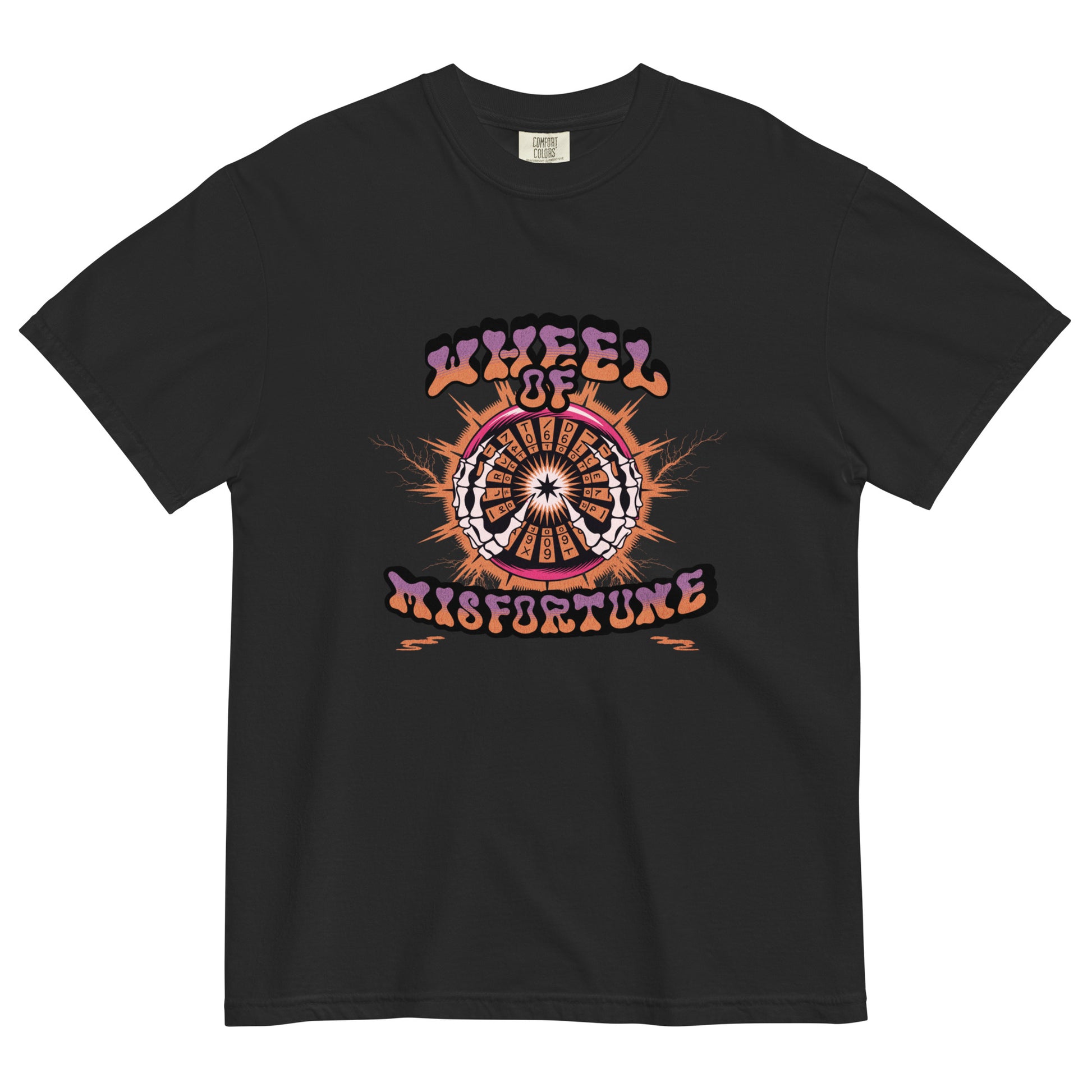 Black t-shirt lay flat featuring “Wheel of Misfortune” text with an illustrated tarot-style wheel surrounded by fire and celestial details, a darkly funny occult tee.