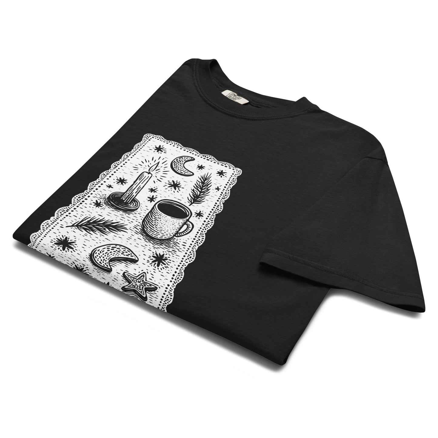 Folded lay-flat view of black witchy coffee and stars T-shirt, showing detailed celestial design print.