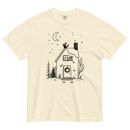 Ivory Comfort Colors T-shirt with cozy witchy cottage design featuring moon, wreath, and snow, shown lay flat on white background.