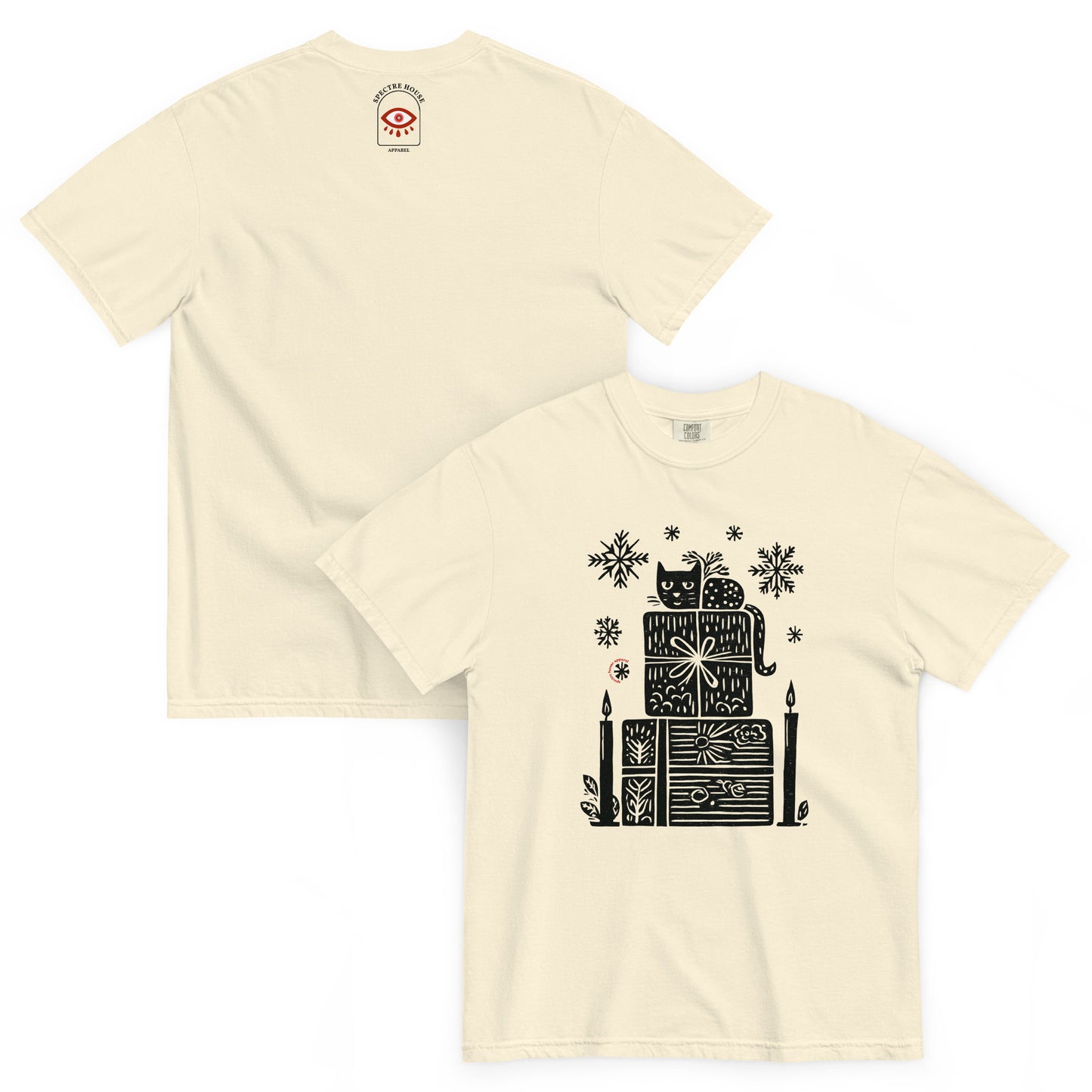 Folded lay-flat view of ivory witchy gift stack T-shirt showing detailed black festive print and candle illustration.