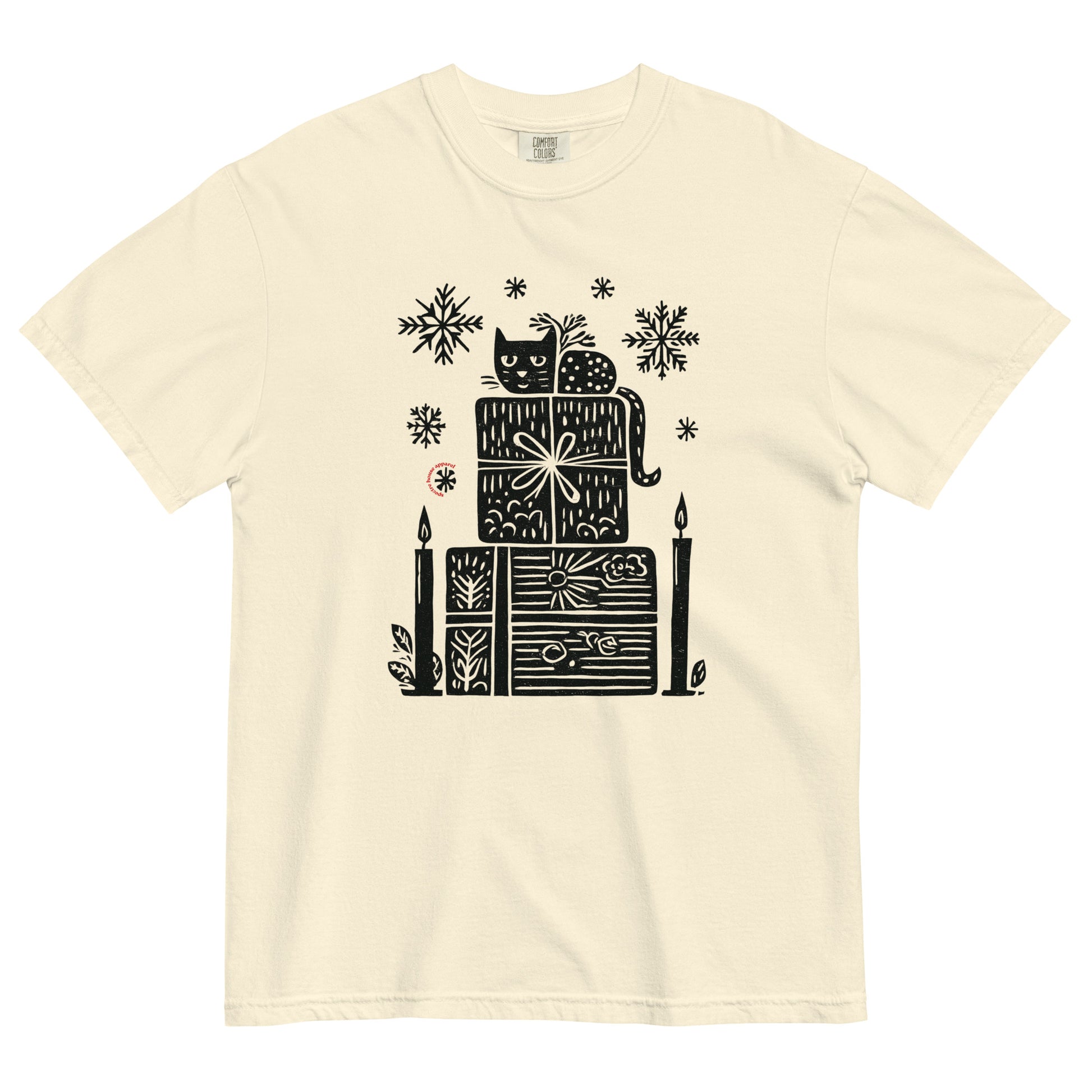 Ivory Comfort Colors T-shirt with black candle and gift stack holiday design, shown lay flat on white background.