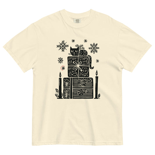 Ivory Comfort Colors T-shirt with black candle and gift stack holiday design, shown lay flat on white background.