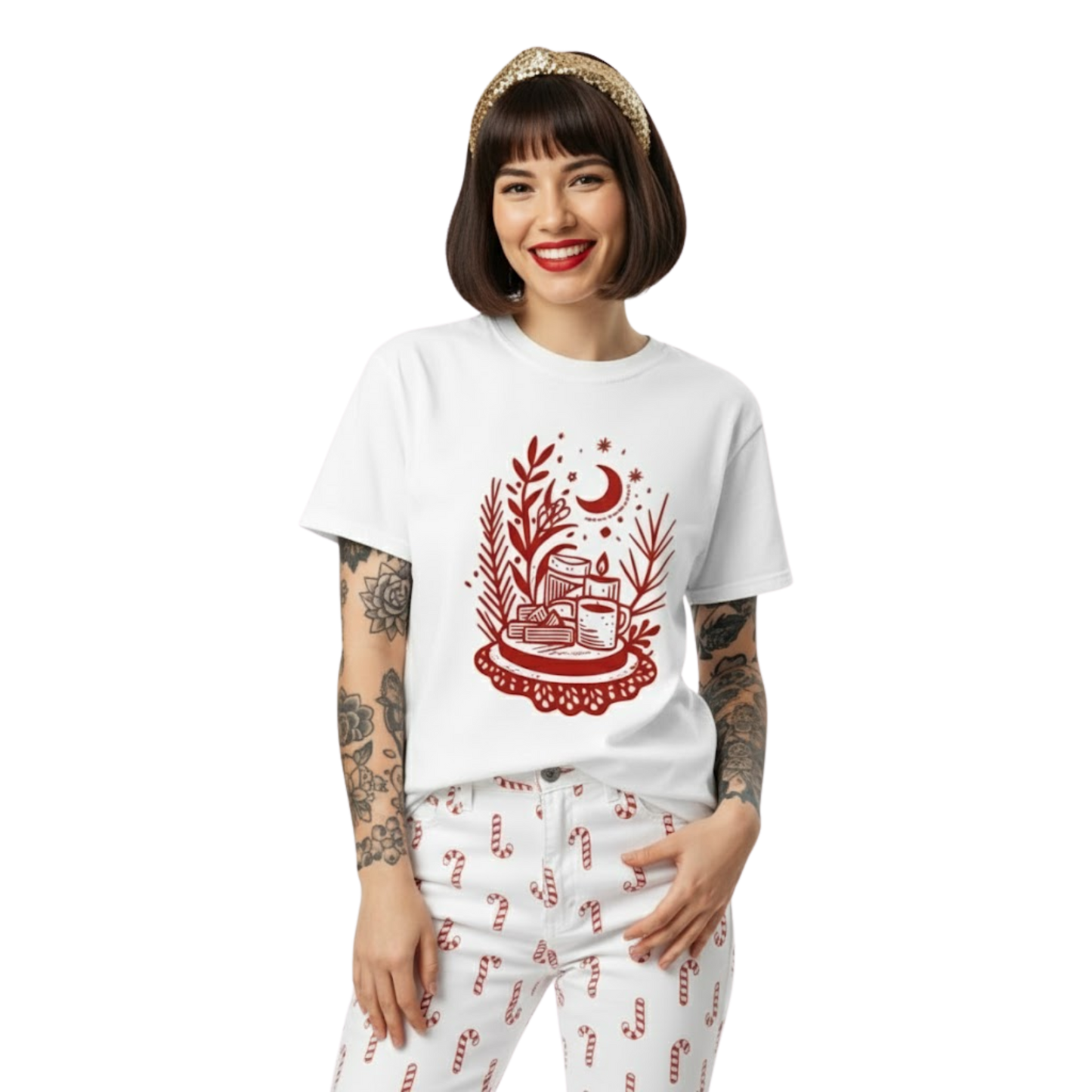 Woman wearing white witchy tea time T-shirt with red moon and teacup design, styled with patterned pants and casual cozy vibe.