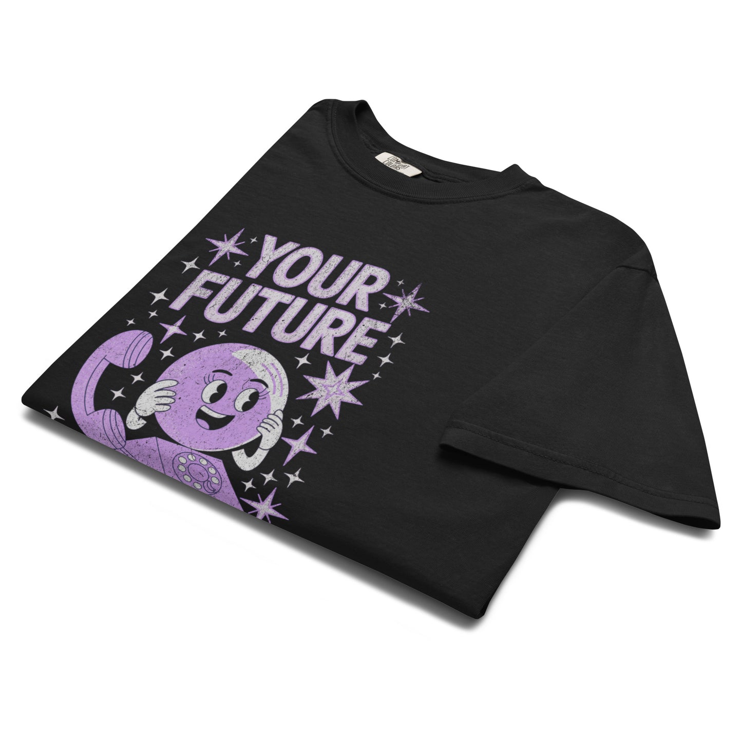 Folded black “Your Future Is On Hold” t-shirt flat lay with purple glitter-style phone design and playful gothic text, perfect for lovers of retro irony and dark humor.