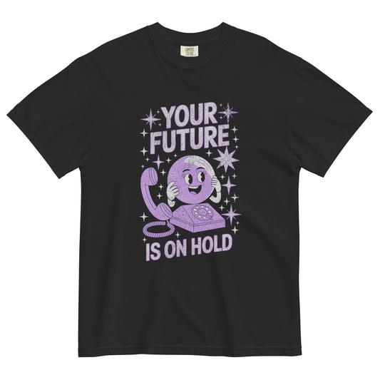 Black t-shirt with retro-style purple cartoon phone and text reading “Your Future Is On Hold,” a sarcastic vintage graphic tee with nostalgic Y2K humor.